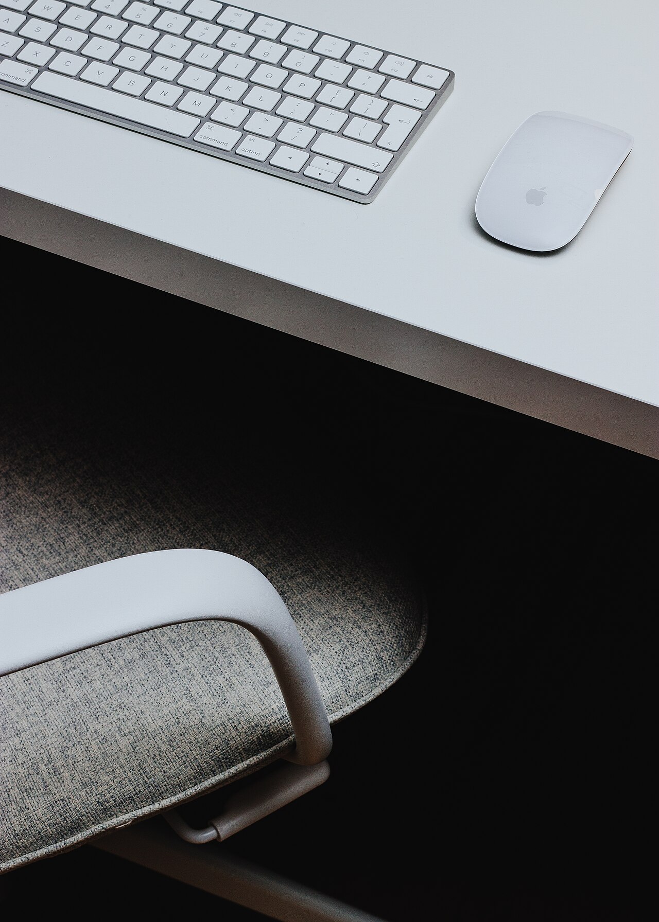 A home office desk with a laptop